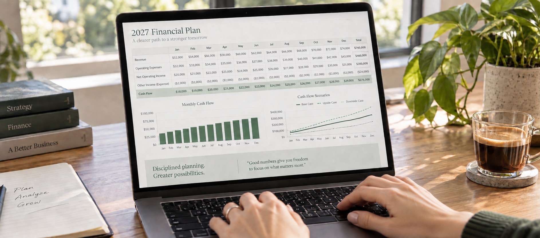 Laptop displaying a financial budget, monthly cash flow chart, and planning scenarios